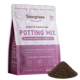 Front of the Sawgrass Organics Potting Mix 4 QT bag with the OMRI Listed seal, beside a pile of the dark, fine-textured mix
